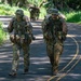 Multinational Soldiers hike Kolekole Pass at the 2026 Pacific Land Forces Team Readiness Challenge