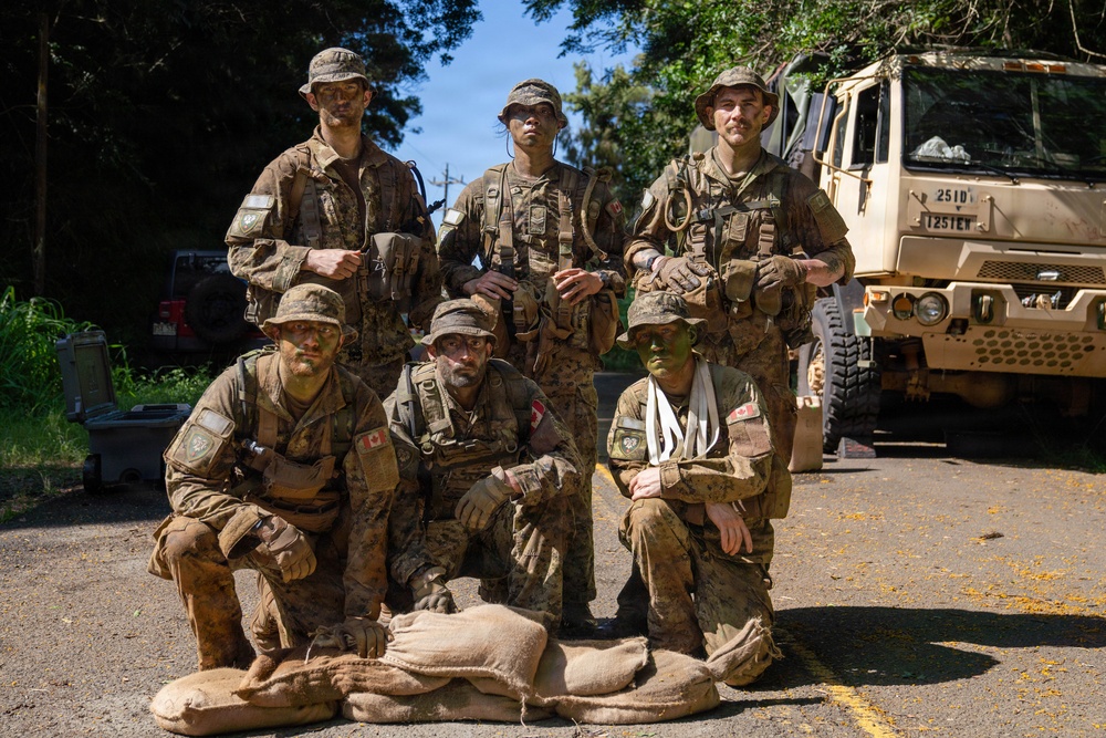Multinational Soldiers hike Kolekole Pass at the 2026 Pacific Land Forces Team Readiness Challenge