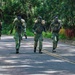 Multinational Soldiers hike Kolekole Pass at the 2026 Pacific Land Forces Team Readiness Challenge