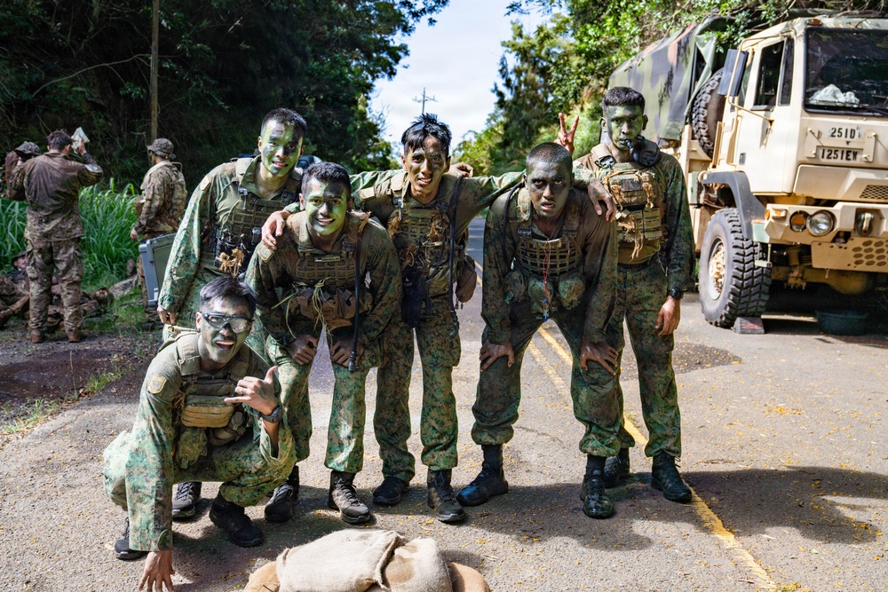 Multinational Soldiers hike Kolekole Pass at the 2026 Pacific Land Forces Team Readiness Challenge