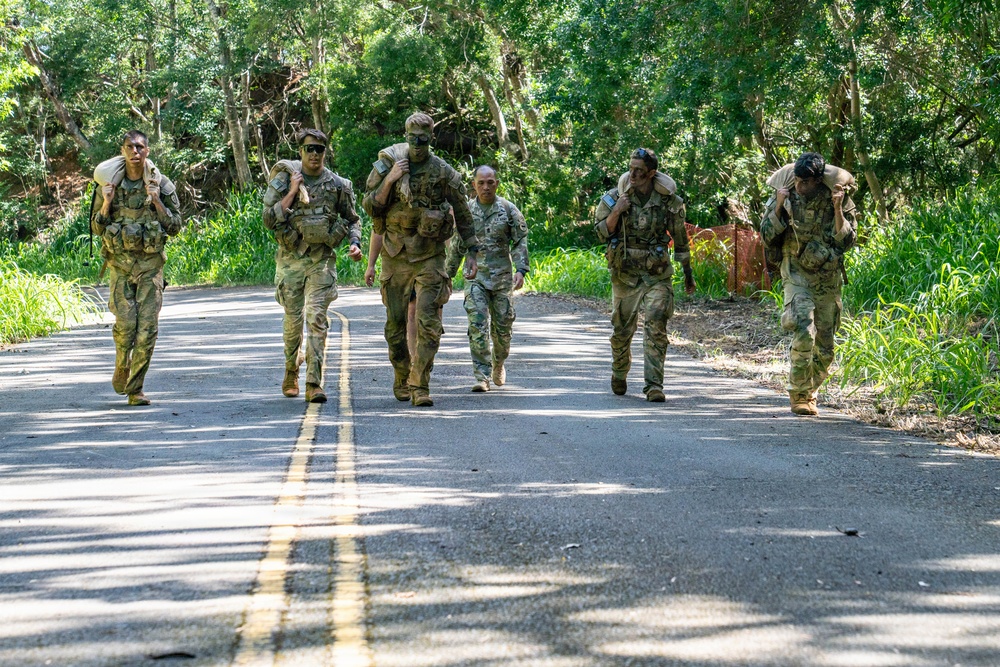 Multinational Soldiers hike Kolekole Pass at the 2026 Pacific Land Forces Team Readiness Challenge