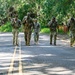Multinational Soldiers hike Kolekole Pass at the 2026 Pacific Land Forces Team Readiness Challenge