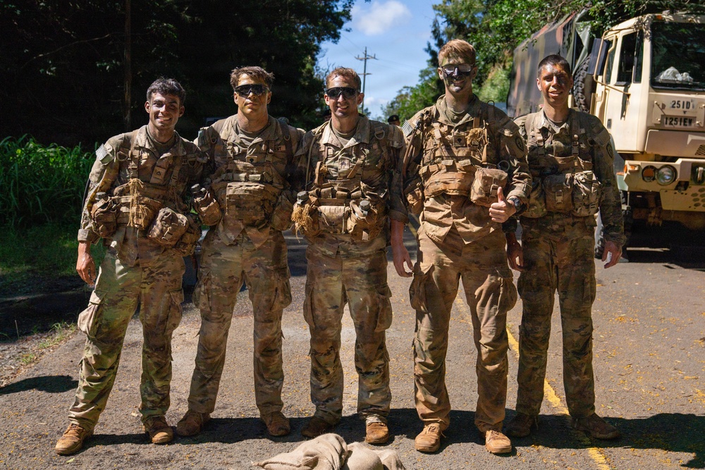 Multinational Soldiers hike Kolekole Pass at the 2026 Pacific Land Forces Team Readiness Challenge