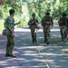 Multinational Soldiers hike Kolekole Pass at the 2026 Pacific Land Forces Team Readiness Challenge