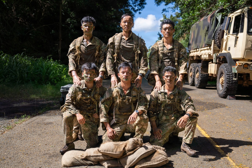 Multinational Soldiers hike Kolekole Pass at the 2026 Pacific Land Forces Team Readiness Challenge