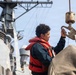 USS Mitscher (DDG 57) Sailor secures hoist during boat operations