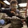 USS Mitscher (DDG 57) Sailor operates lathe in machine shop
