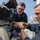 USS Mitscher (DDG 57) Sailors inspect 25mm machine gun