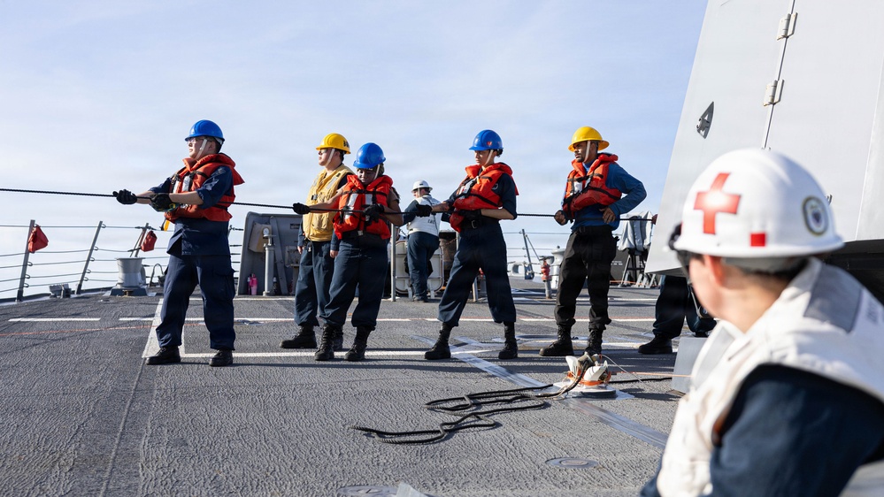 USS Mustin conducts a replenishment-at-sea