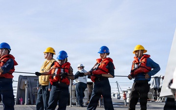 USS Mustin conducts a replenishment-at-sea