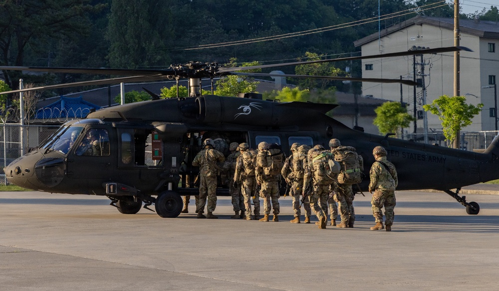 Eighth Army Soldiers board UH-60 Black Hawk during Best Squad Competition