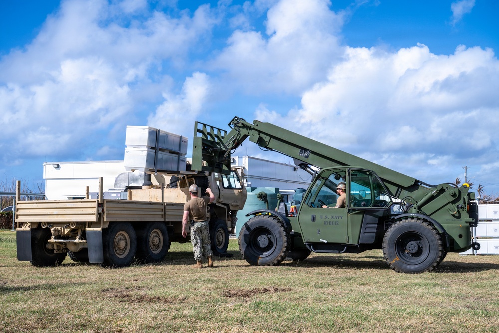 Sailors and Soldiers construct temporary shelters for Saipan residents affected by Super Typhoon Sinlaku