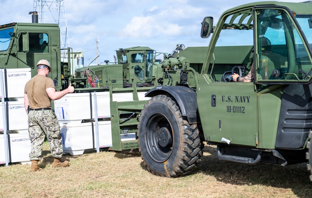 Sailors and Soldiers construct temporary shelters for Saipan residents affected by Super Typhoon Sinlaku