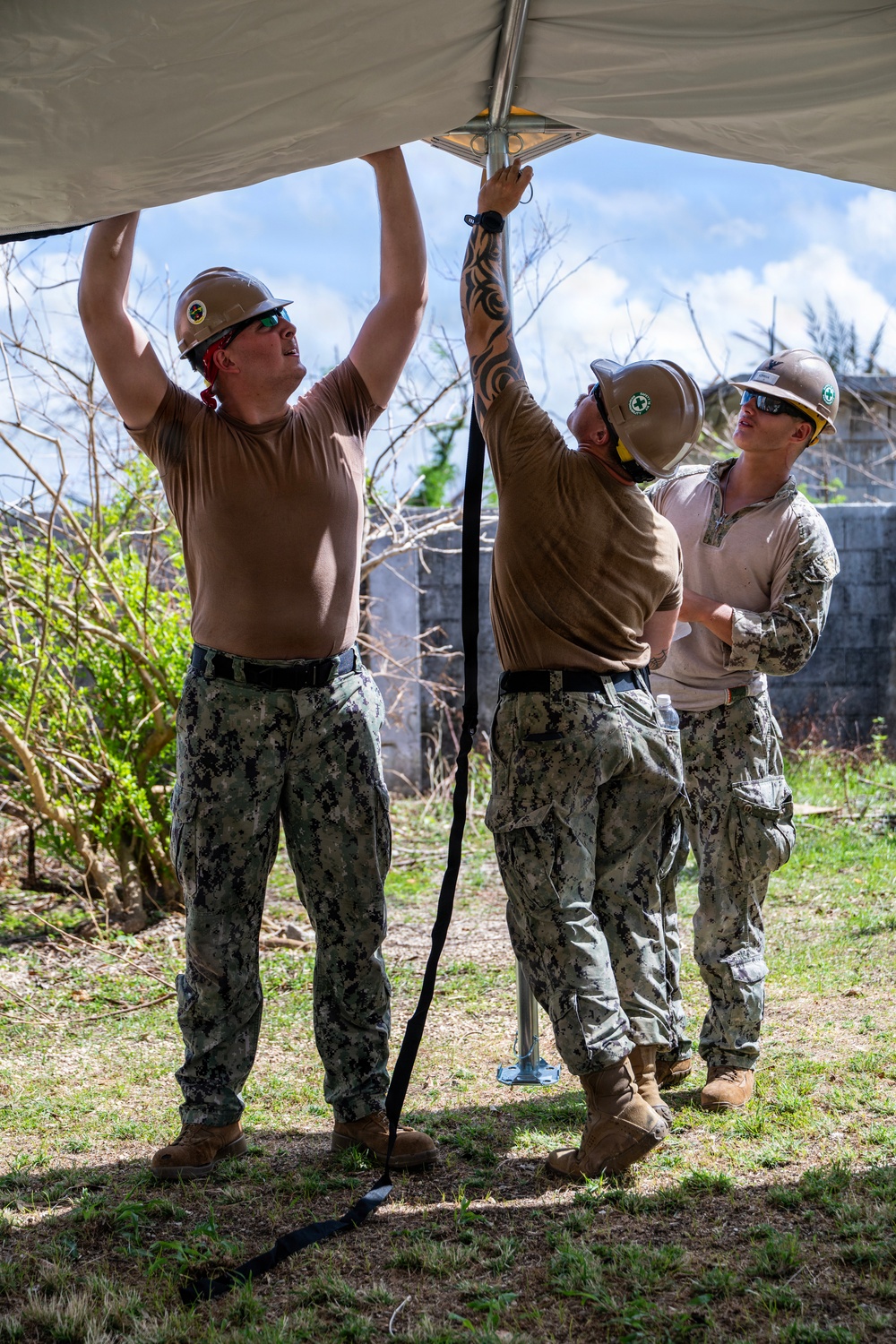 Sailors and Soldiers construct temporary shelters for Saipan residents affected by Super Typhoon Sinlaku