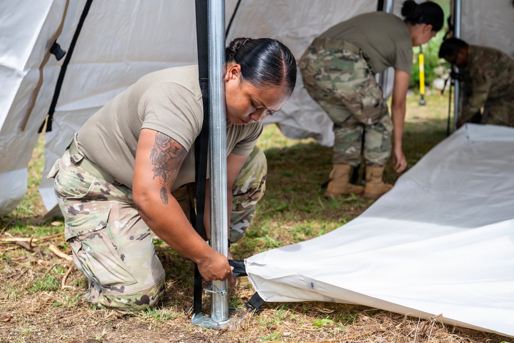 Sailors and Soldiers construct temporary shelters for Saipan residents affected by Super Typhoon Sinlaku