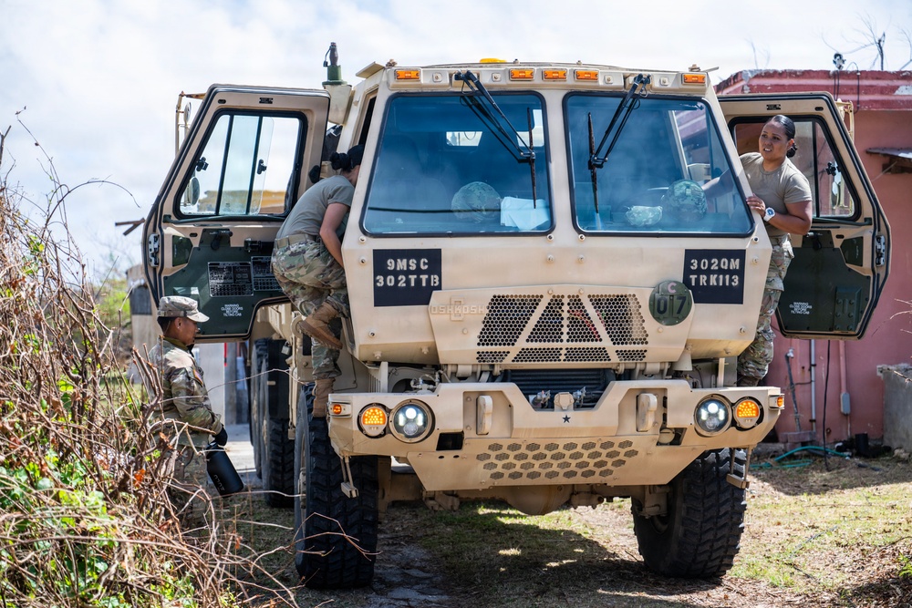 Sailors and Soldiers construct temporary shelters for Saipan residents affected by Super Typhoon Sinlaku