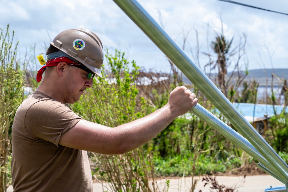 Sailors and Soldiers construct temporary shelters for Saipan residents affected by Super Typhoon Sinlaku