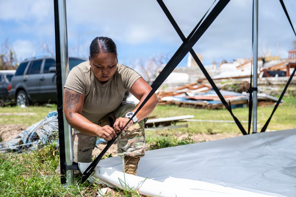 Sailors and Soldiers construct temporary shelters for Saipan residents affected by Super Typhoon Sinlaku