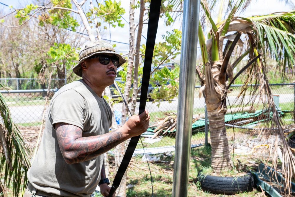 Sailors and Soldiers construct temporary shelters for Saipan residents affected by Super Typhoon Sinlaku