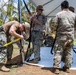Sailors and Soldiers construct temporary shelters for Saipan residents affected by Super Typhoon Sinlaku