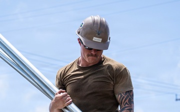Sailors and Soldiers construct temporary shelters for Saipan residents affected by Super Typhoon Sinlaku