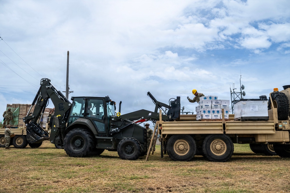 Sailors and Soldiers deliver emergency supplies for Saipan residents affected by Super Typhoon Sinlaku