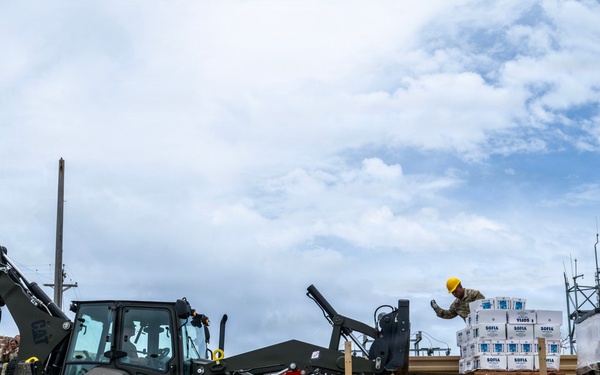 Sailors and Soldiers deliver emergency supplies for Saipan residents affected by Super Typhoon Sinlaku