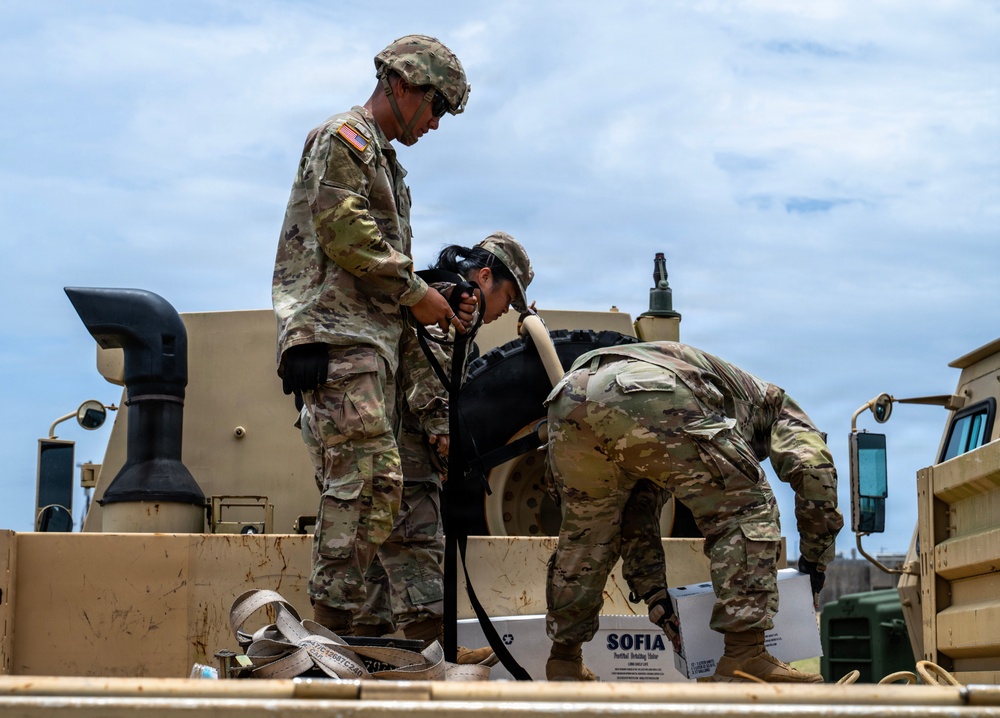 Sailors and Soldiers deliver emergency supplies for Saipan residents affected by Super Typhoon Sinlaku