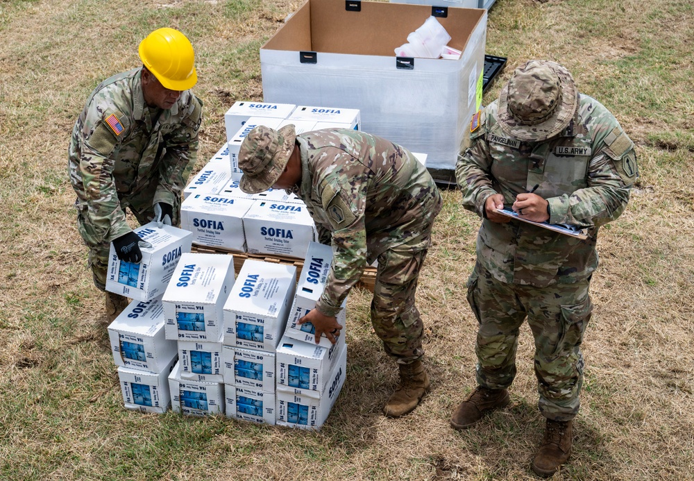 Sailors and Soldiers deliver emergency supplies for Saipan residents affected by Super Typhoon Sinlaku