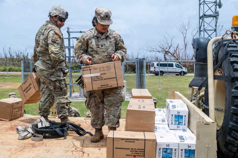 Sailors and Soldiers deliver emergency supplies for Saipan residents affected by Super Typhoon Sinlaku