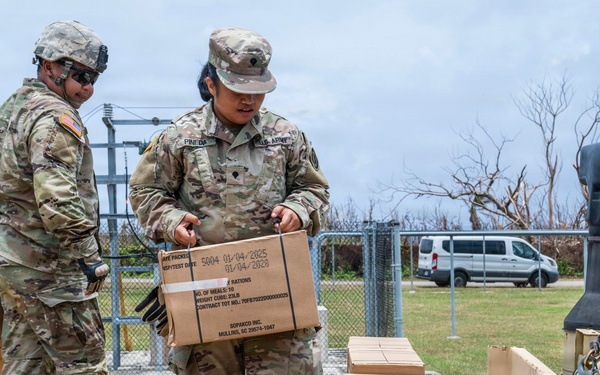 Sailors and Soldiers deliver emergency supplies for Saipan residents affected by Super Typhoon Sinlaku