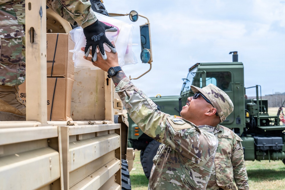 Sailors and Soldiers deliver emergency supplies for Saipan residents affected by Super Typhoon Sinlaku