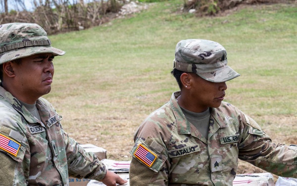 Sailors and Soldiers deliver emergency supplies for Saipan residents affected by Super Typhoon Sinlaku