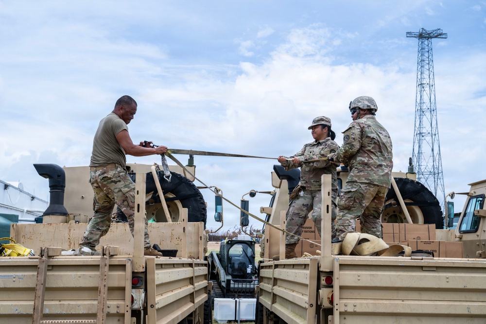 Sailors and Soldiers deliver emergency supplies for Saipan residents affected by Super Typhoon Sinlaku