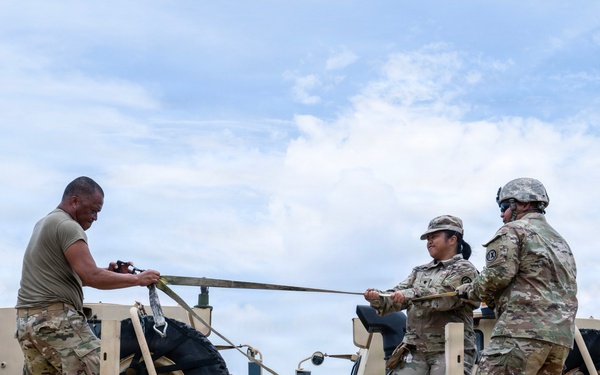 Sailors and Soldiers deliver emergency supplies for Saipan residents affected by Super Typhoon Sinlaku