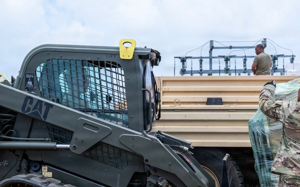 Sailors and Soldiers deliver emergency supplies for Saipan residents affected by Super Typhoon Sinlaku