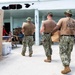 Sailors and Soldiers deliver emergency supplies for Saipan residents affected by Super Typhoon Sinlaku