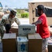 Sailors and Soldiers deliver emergency supplies for Saipan residents affected by Super Typhoon Sinlaku