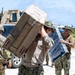 Sailors and Soldiers deliver emergency supplies for Saipan residents affected by Super Typhoon Sinlaku