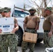 Sailors and Soldiers deliver emergency supplies for Saipan residents affected by Super Typhoon Sinlaku