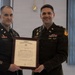 U.S. Army Officers Pose with Framed Presidential Certificate During Military Ceremony