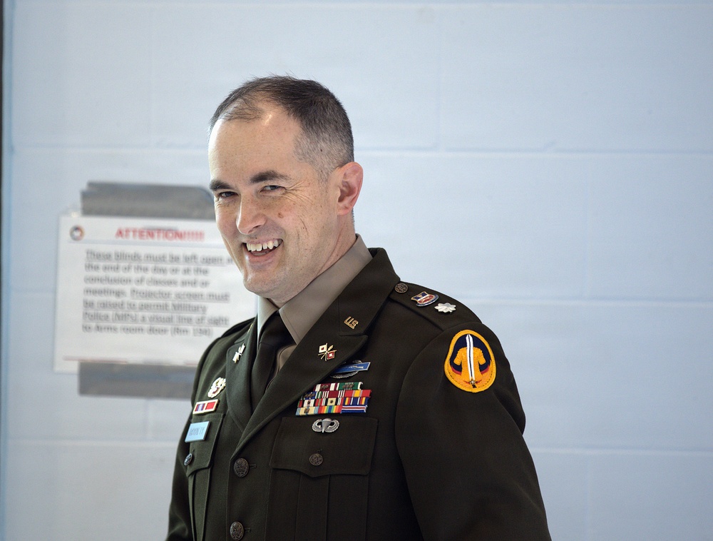 U.S. Army Officer in Class A Dress Uniform Smiles During Promotion