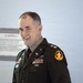 U.S. Army Officer in Class A Dress Uniform Smiles During Promotion