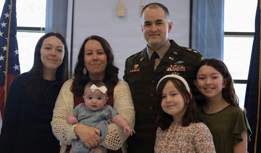 U.S. Army Officer Poses with Family During Military Ceremony