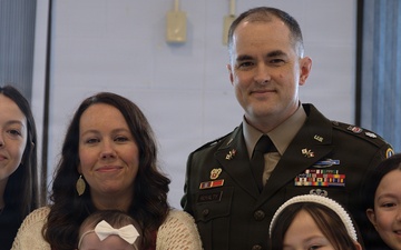 U.S. Army Officer Poses with Family During Military Ceremony