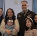 U.S. Army Officer Poses with Family During Military Ceremony