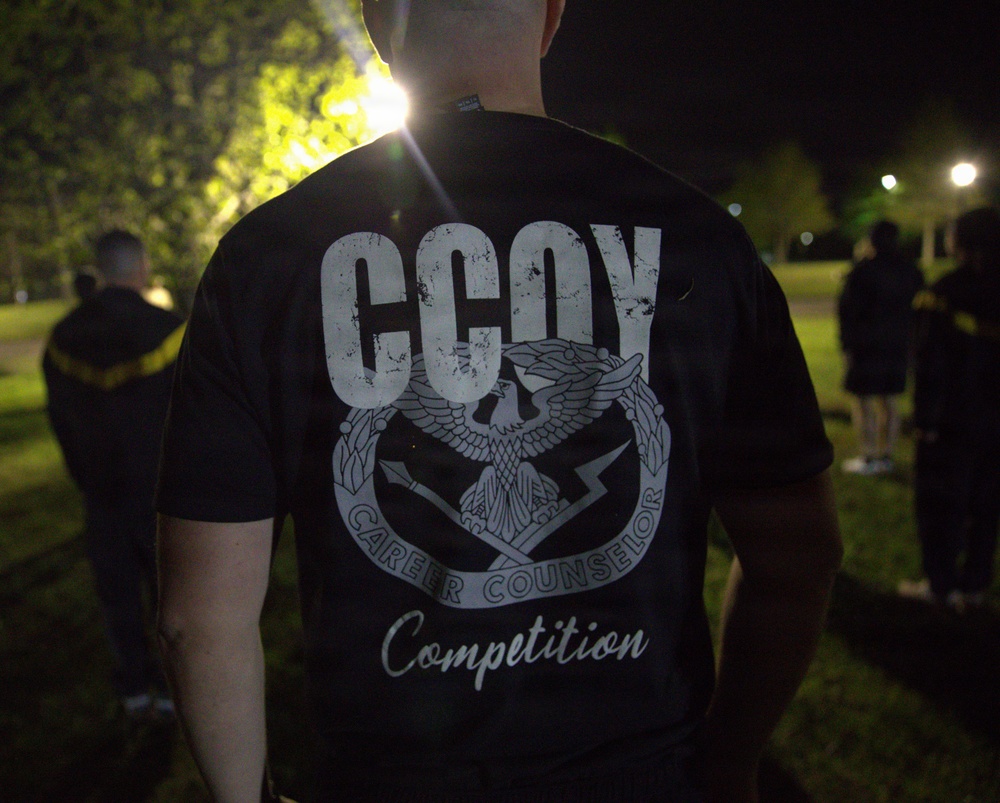Soldier Wears CCOY Career Counselor Competition T-Shirt During Nighttime Event