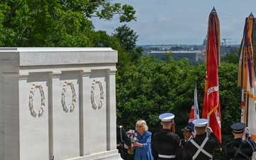 Queen Camilla receives a flower bouquet to place at the Tomb of the Unknown Soldier