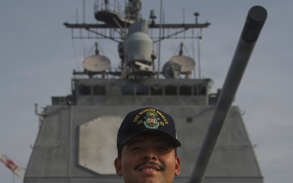 U.S. Navy Sailor Valadez Displays Challenge Coin Aboard USS Robert Smalls (CG-62)