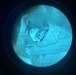 Night Vision Optic View of Injured or Resting Individual During Nighttime Medical or Rescue Operation